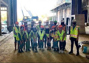 Student group Building Women in Construction on a site visit