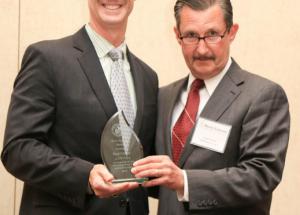 Paul Carter receives Myers-Lawson Award, presented by Robert Wells, MLSoC Industry Board Chair