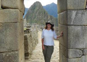 Christine Fiori stands on the Inca Road at Machu Picchu.