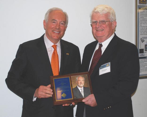 John Donnelly presenting award to A. Ross Myers. Mr Donnelly is the CEO of the L.F. Driscoll Company, LLC, a construction mangement company and one of the largest general contracting firms in the Philadelphia region.  He is a 1972 civil engineering graduate of Drexel University. 