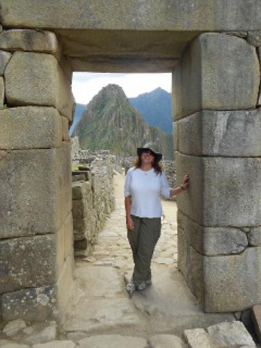 Christine Fiori stands on the Inca Road at Machu Picchu.